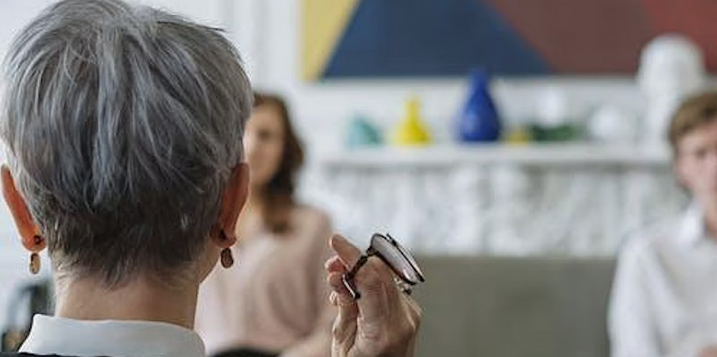 Woman holding glasses